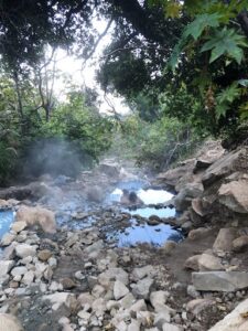 his scenic hike leads you to natural hot springs where you can indulge in a soothing soak